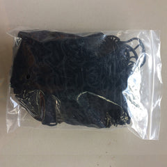 Black lace fabric in a clear plastic bag on a beige background