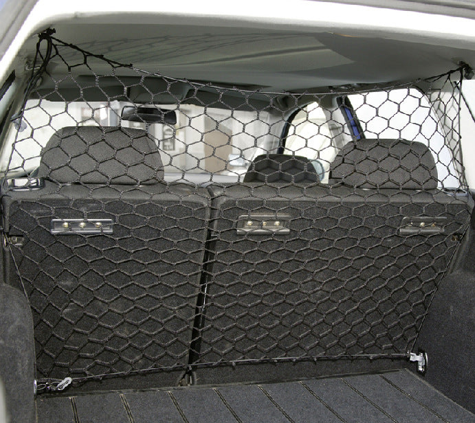 Car trunk with a black cargo net dividing the seats
